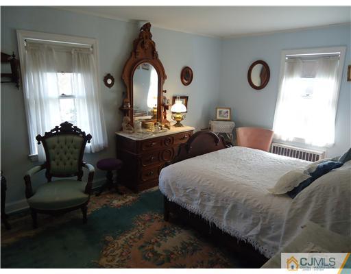 3 Ridge Lane Colonia, NJ 07067 - Photo 8 of 13 a bedroom with bed and window