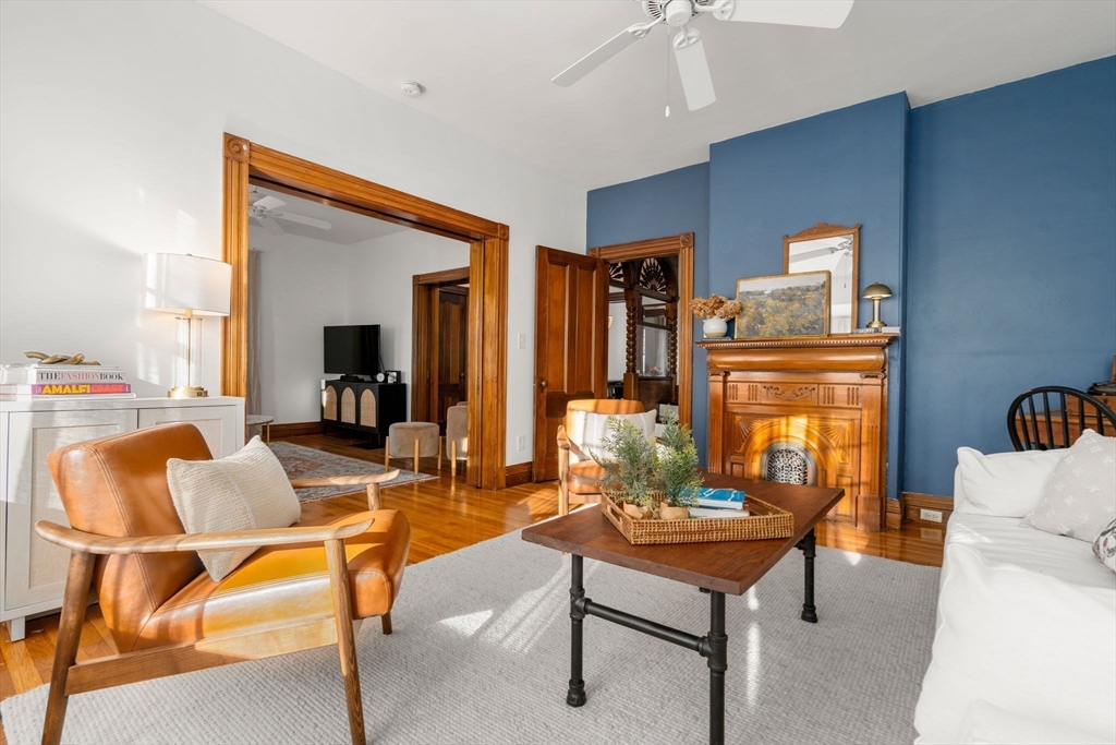 3 Ocean Street Boston, MA 02124 - Photo 11 of 42 a living room with furniture a rug and white walls
