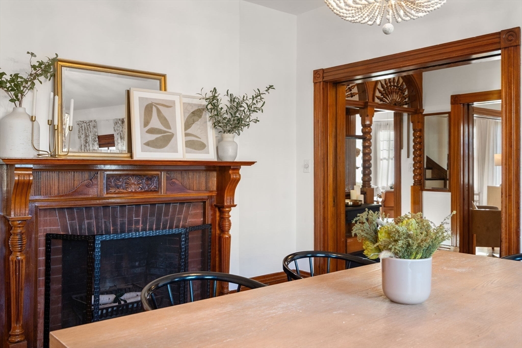 3 Ocean Street Boston, MA 02124 - Photo 15 of 42 a living room with a fireplace and potted plants