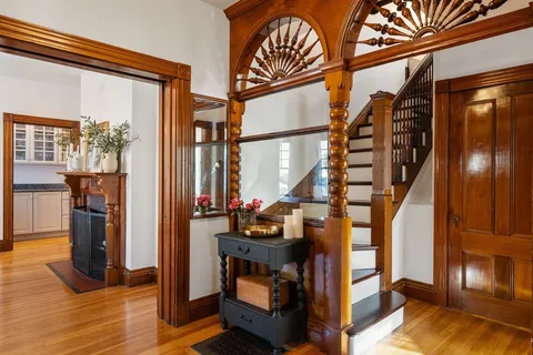 a view of living room with furniture and entryway