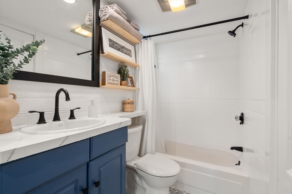 3 Ocean Street Boston, MA 02124 - Photo 21 of 42 a bathroom with a sink a toilet and shower