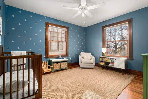 a bedroom with furniture and a window