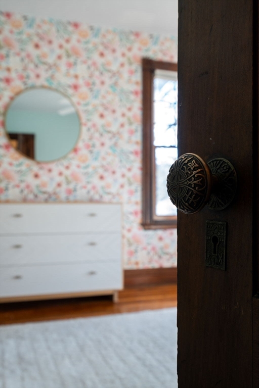3 Ocean Street Boston, MA 02124 - Photo 29 of 42 a bathroom with a granite countertop sink and a mirror