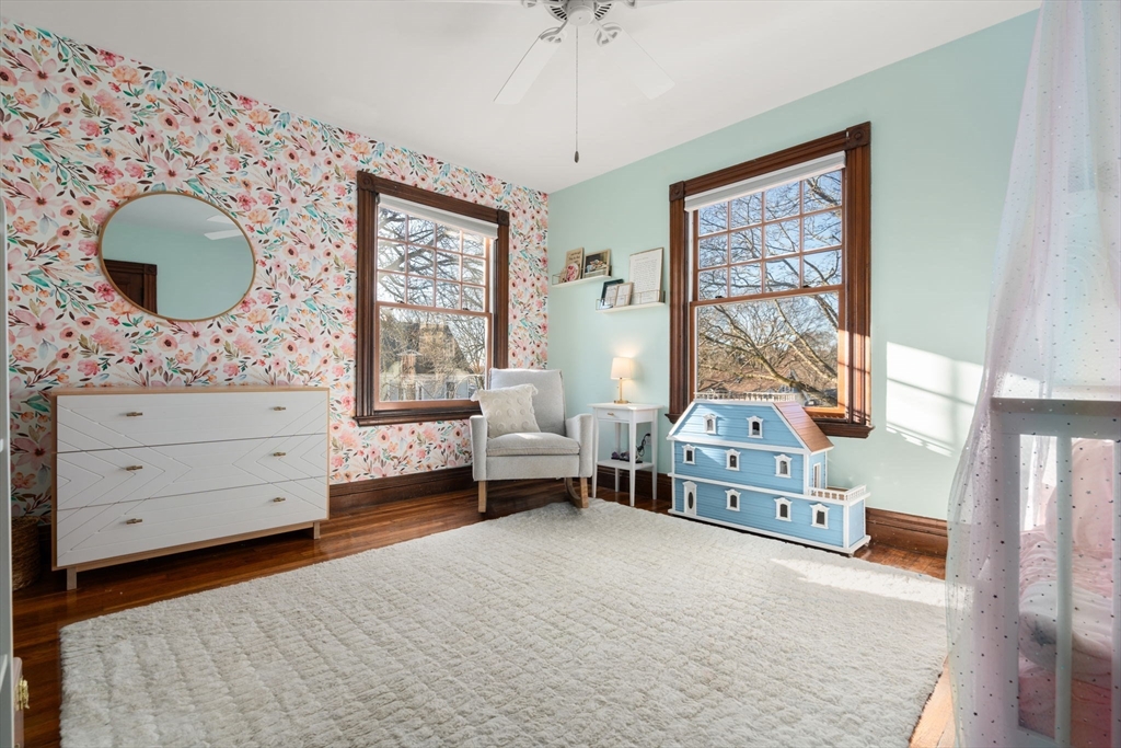 3 Ocean Street Boston, MA 02124 - Photo 30 of 42 a bedroom with a bed and a mirror on the dresser