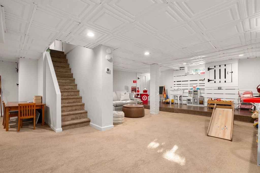 3 Ocean Street Boston, MA 02124 - Photo 34 of 42 a living room with furniture and a chandelier