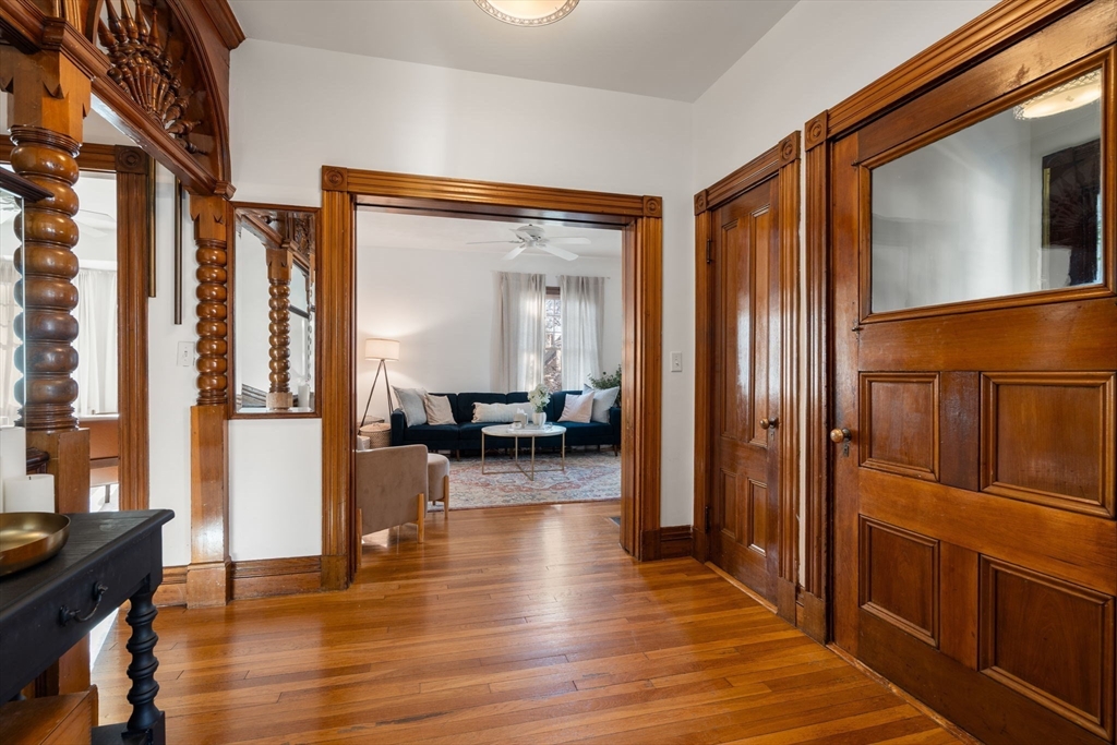 3 Ocean Street Boston, MA 02124 - Photo 4 of 42 a view of a hallway view with living room and wooden floor