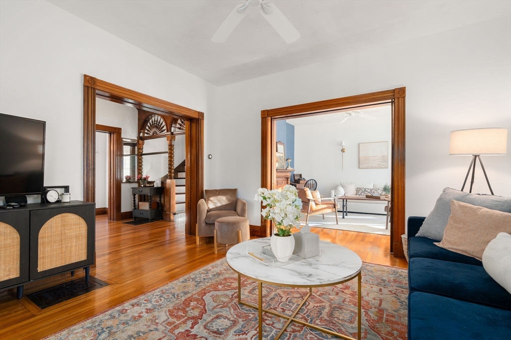3 Ocean Street Boston, MA 02124 - Photo 7 of 42 a living room with furniture and a flat screen tv