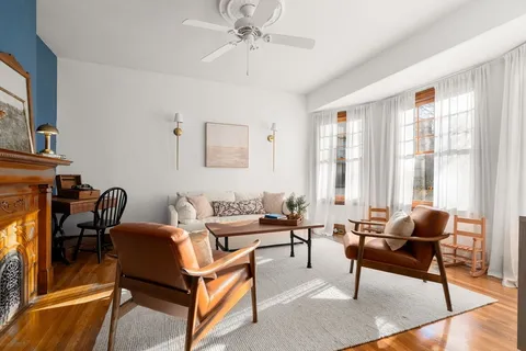 a living room with furniture and a window