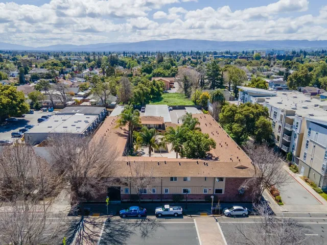 an aerial view of a house with a garden