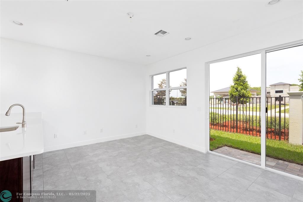 6965 Pines Circle, Unit 29 Pompano Beach, FL 33073 - Photo 12 of 27 a view of a room with sliding glass door
