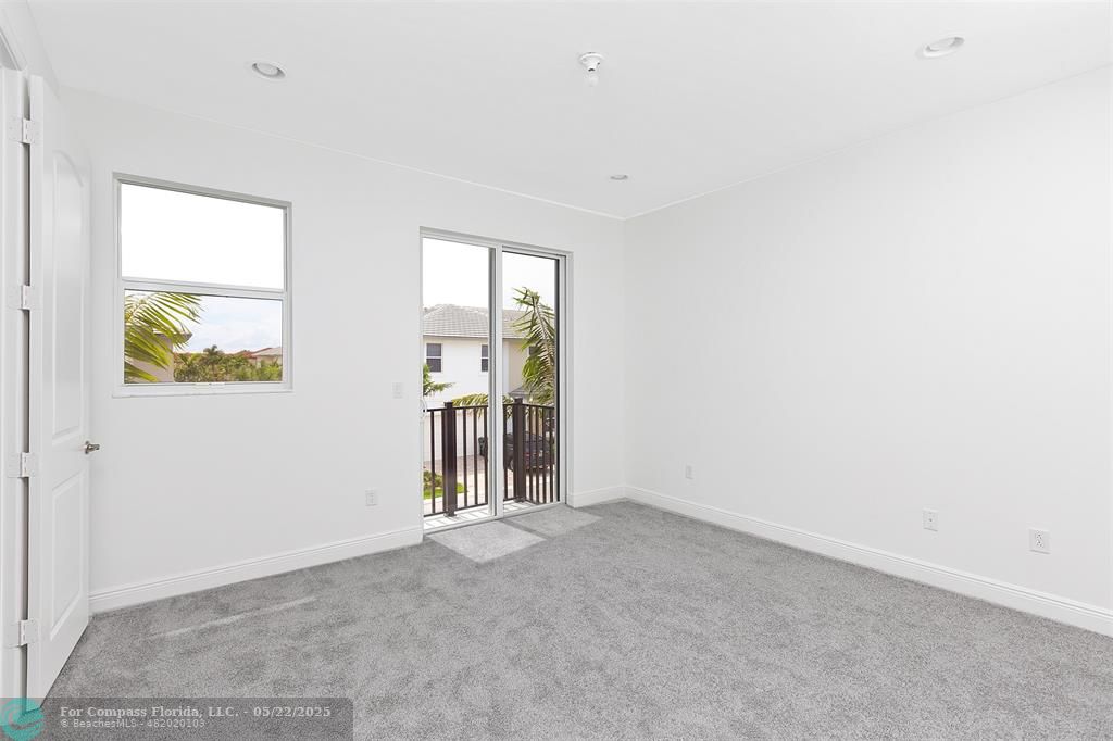 6965 Pines Circle, Unit 29 Pompano Beach, FL 33073 - Photo 17 of 27 an empty room with windows