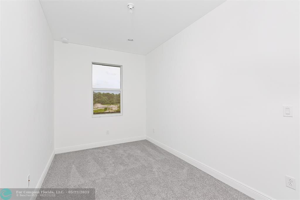 6965 Pines Circle, Unit 29 Pompano Beach, FL 33073 - Photo 21 of 27 an empty room with a window