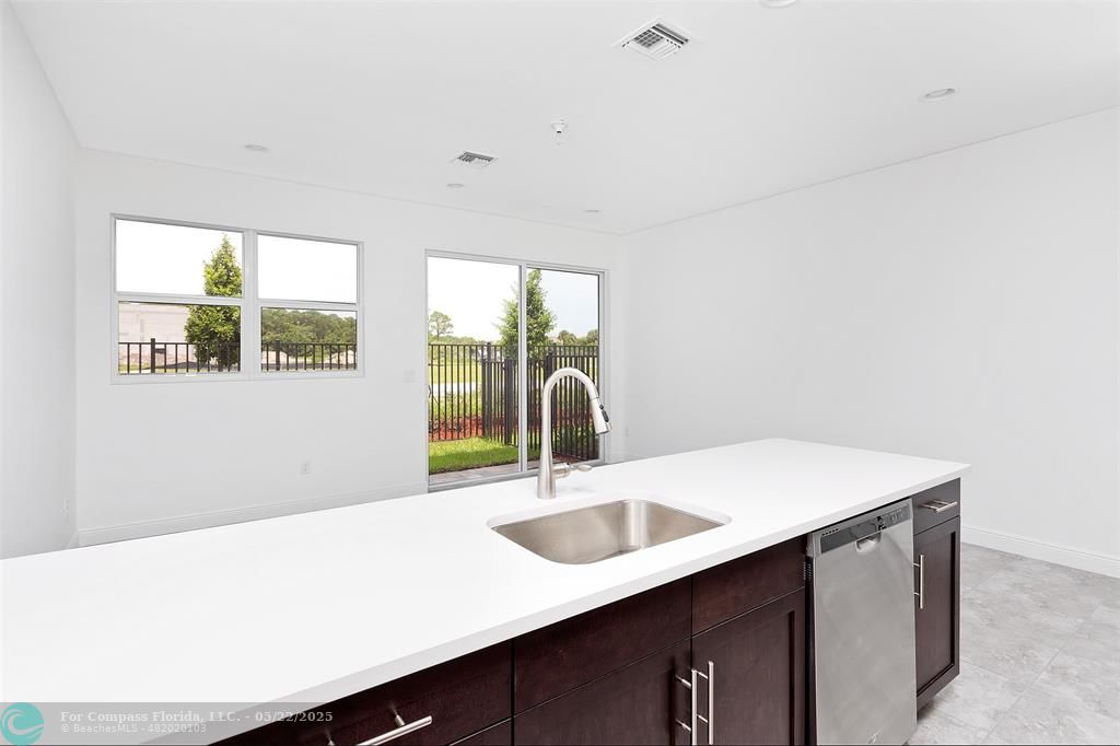 6965 Pines Circle, Unit 29 Pompano Beach, FL 33073 - Photo 10 of 27 a close view of a sink and a cabinet in a room