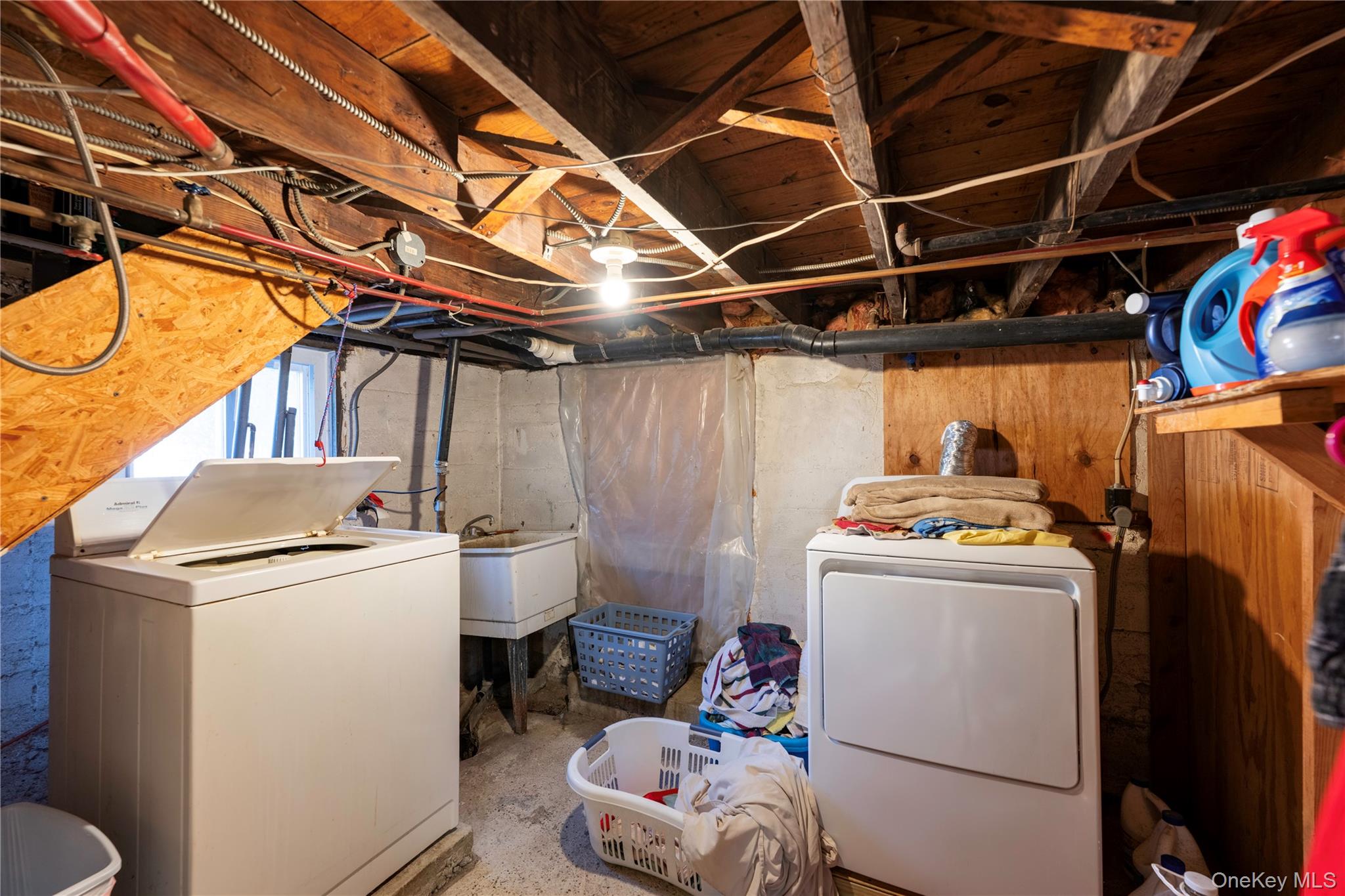 119 Rombout Avenue Beacon, NY 12508 - Photo 23 of 28 Laundry in basement - door to back yard