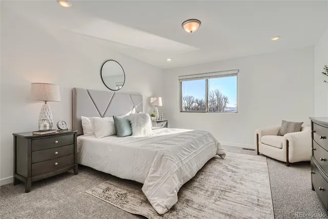 a bedroom with bed and windows