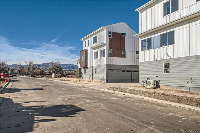 an aerial view of a house with swimming pool garden and patio