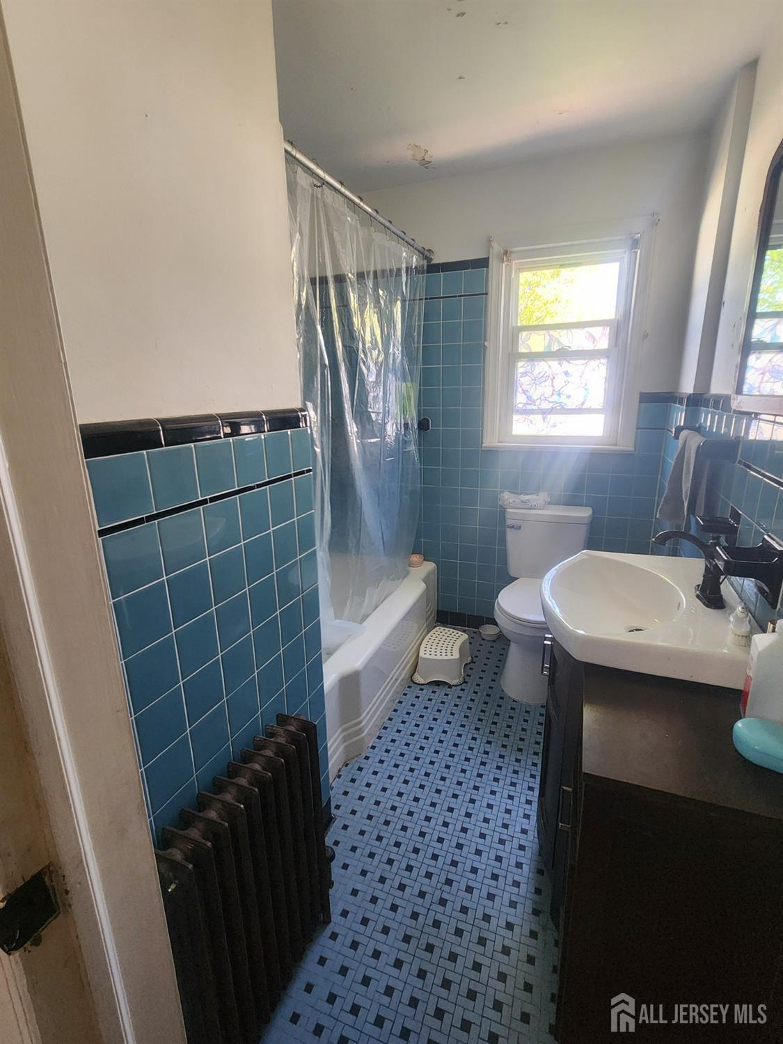 215 Summit Avenue Fords, NJ 08863 - Photo 12 of 15 a bathroom with a sink toilet and shower