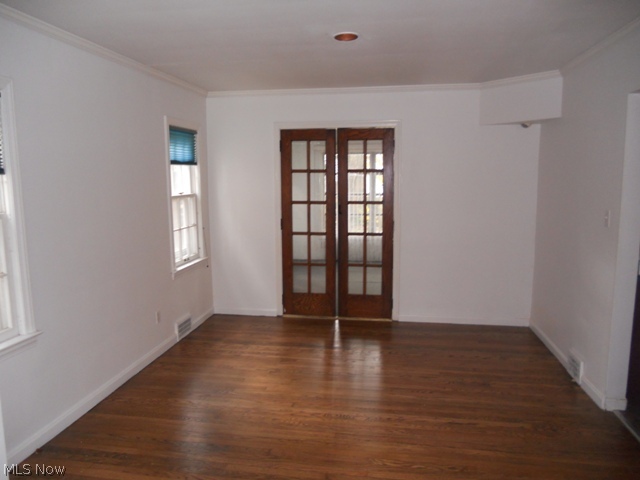 3946 Bushnell Road University Heights, OH 44118 - Photo 3 of 12 Formal Dining Room with Gleaming Hardwood Floors and French Doors Leading to Family Room