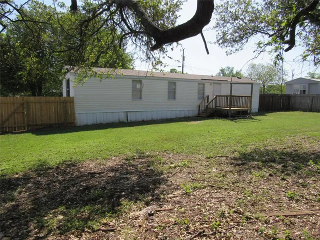 a view of a backyard with a garden
