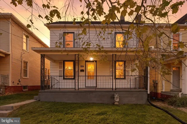 front view of a house with a yard