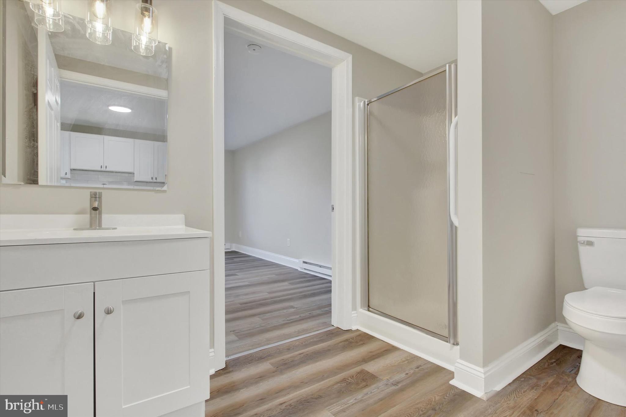 632 East Walnut Street Hanover, PA 17331 - Photo 14 of 30 a bathroom with a sink mirror and toilet