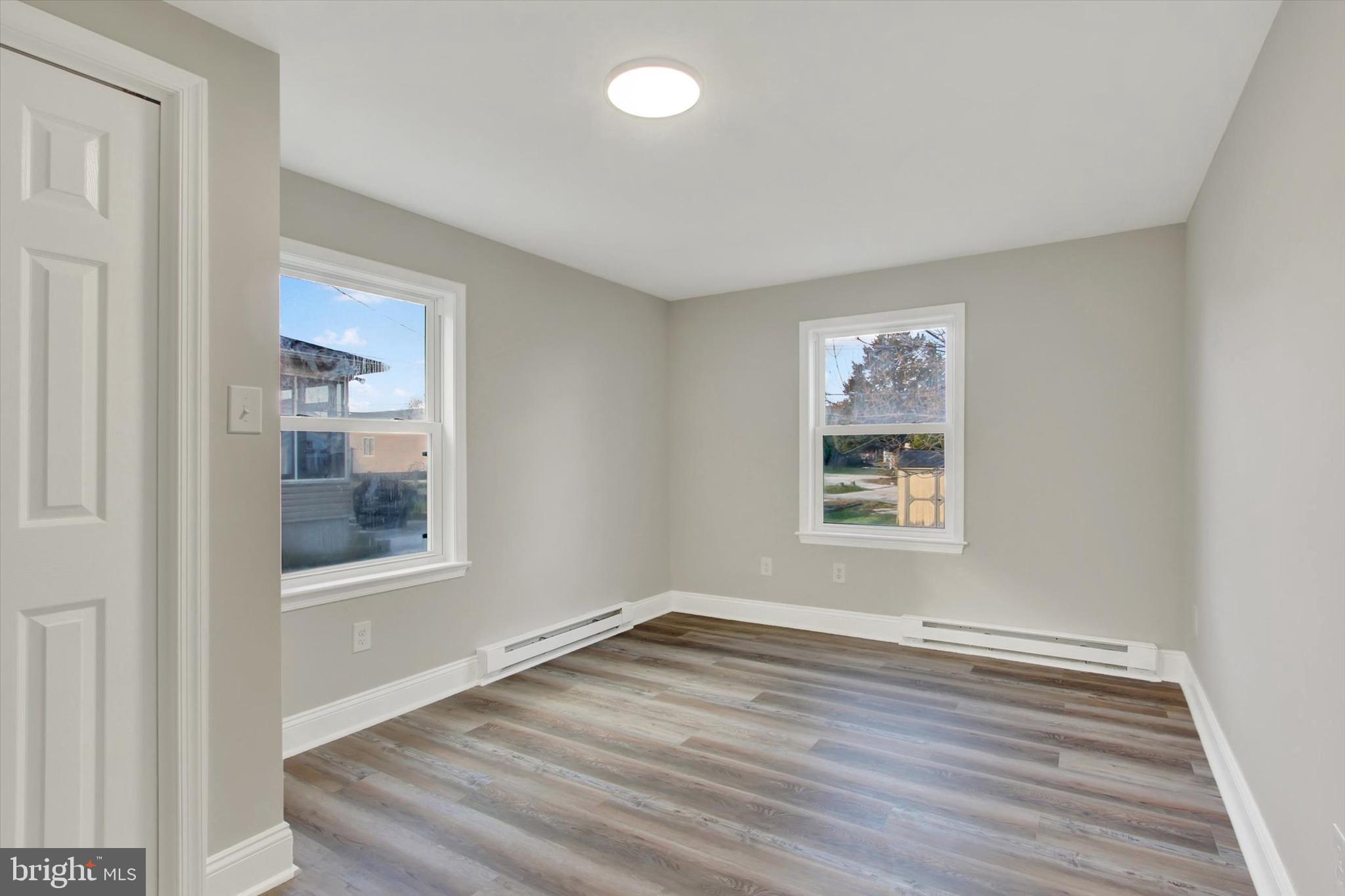 632 East Walnut Street Hanover, PA 17331 - Photo 16 of 30 a view of an empty room with wooden floor and a window