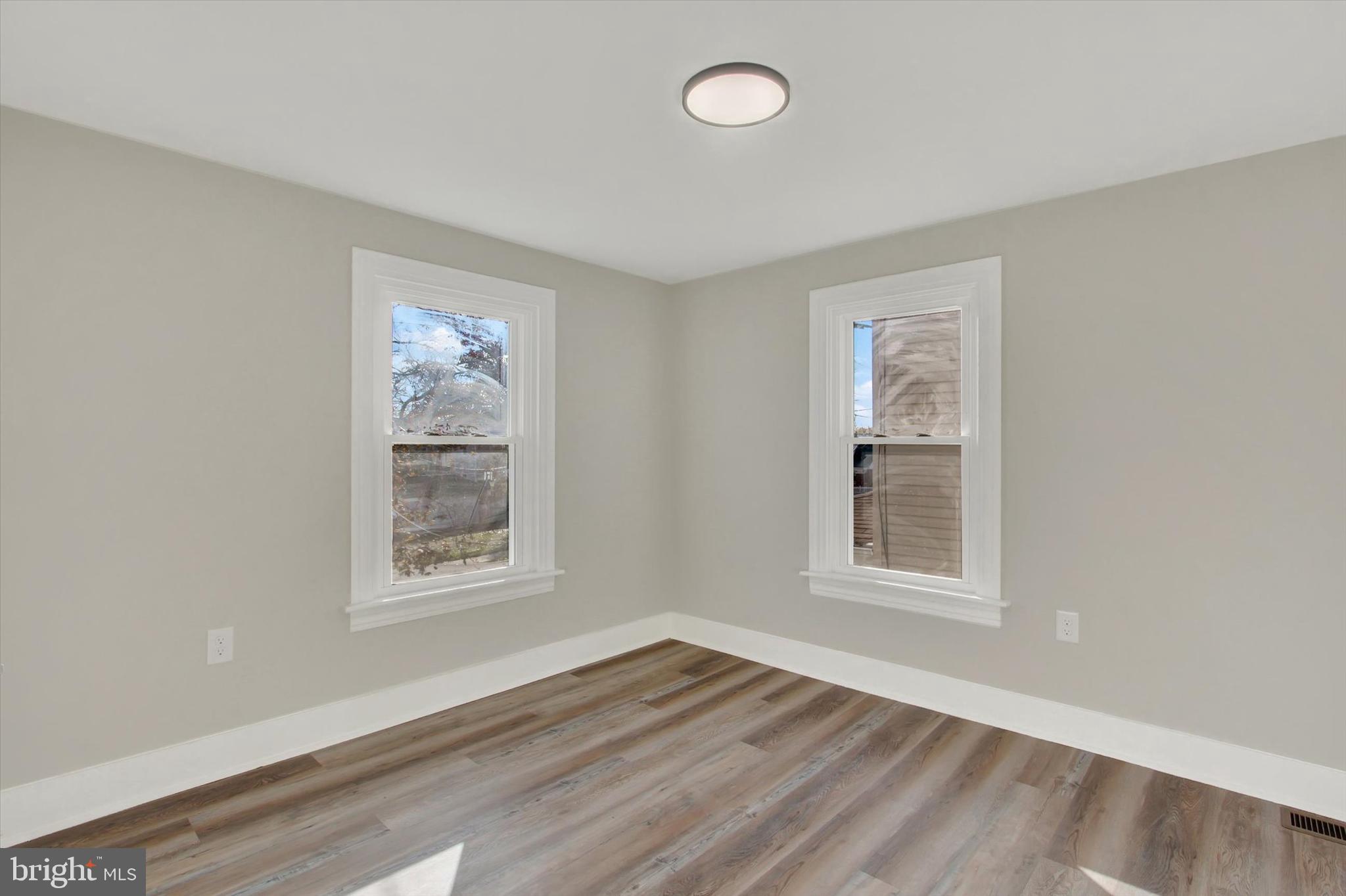 632 East Walnut Street Hanover, PA 17331 - Photo 19 of 30 an empty room with wooden floor and windows