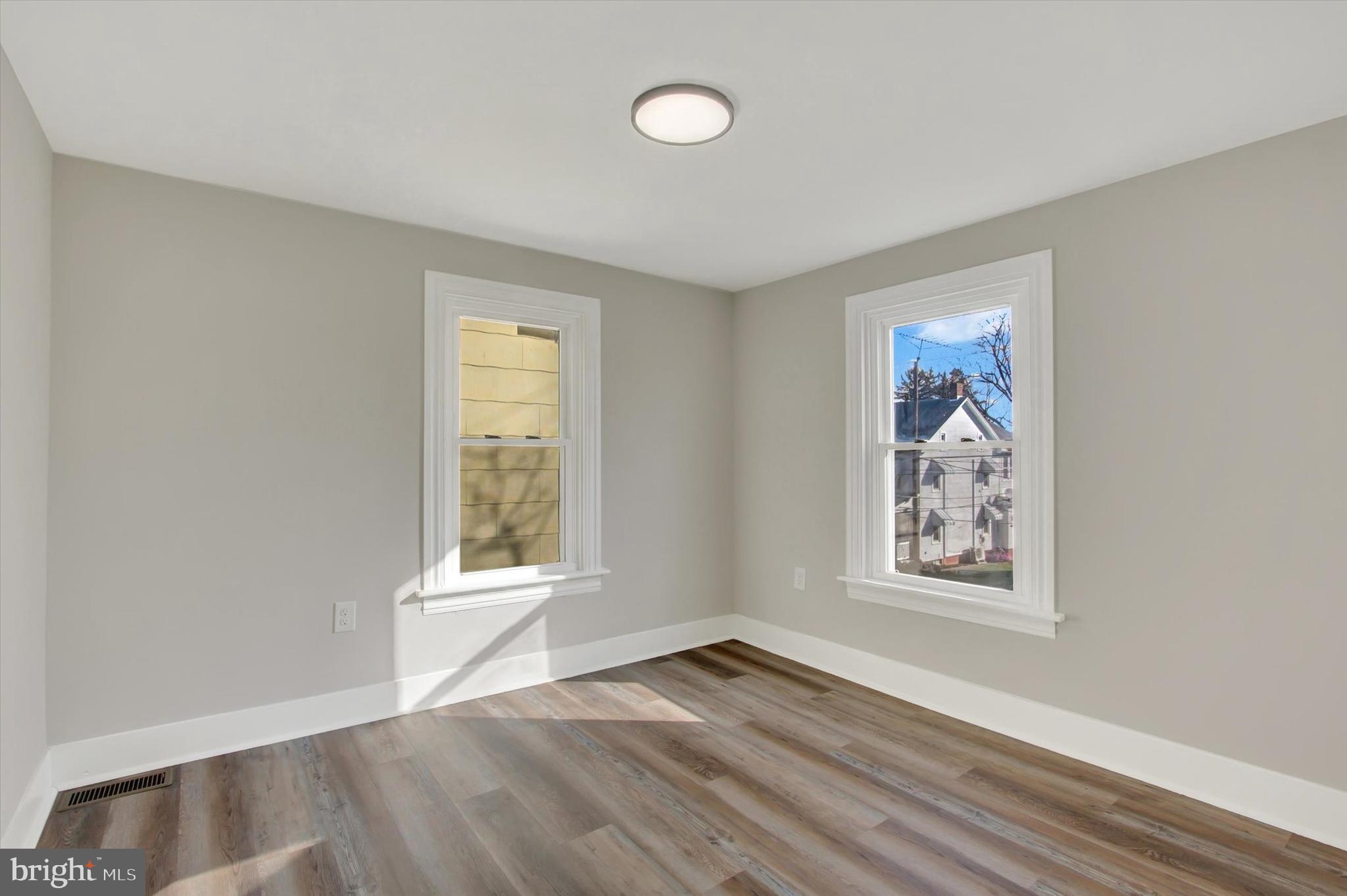 632 East Walnut Street Hanover, PA 17331 - Photo 20 of 30 an empty room with wooden floor and windows