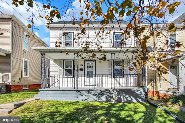 a view of a building with a yard
