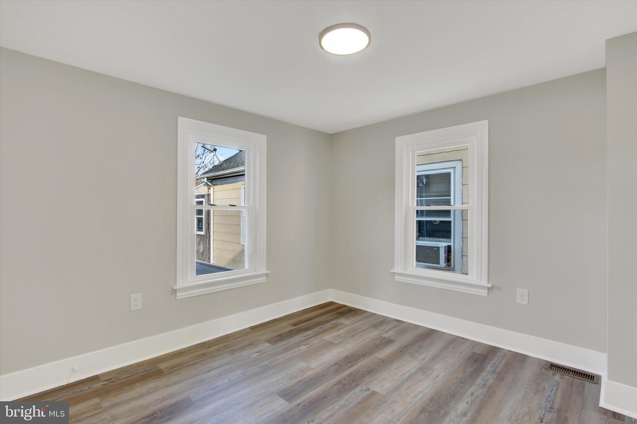 632 East Walnut Street Hanover, PA 17331 - Photo 21 of 30 an empty room with wooden floor and windows