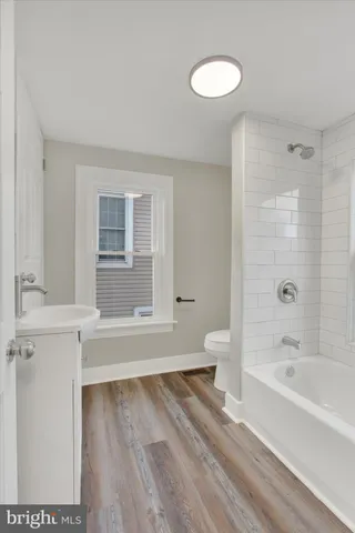 a bathroom with a bathtub and a sink