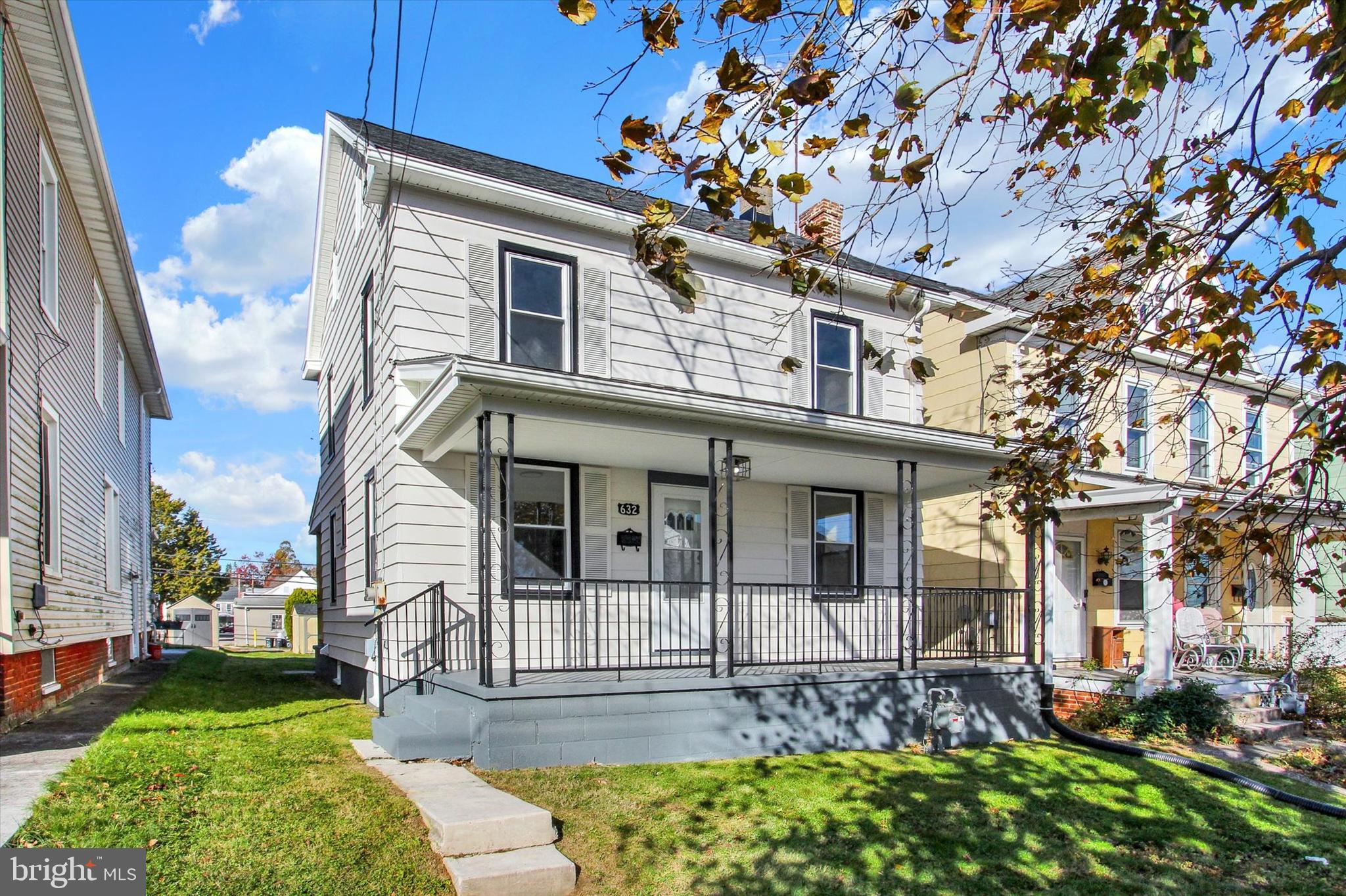 632 East Walnut Street Hanover, PA 17331 - Photo 3 of 30 a front view of a house with garden