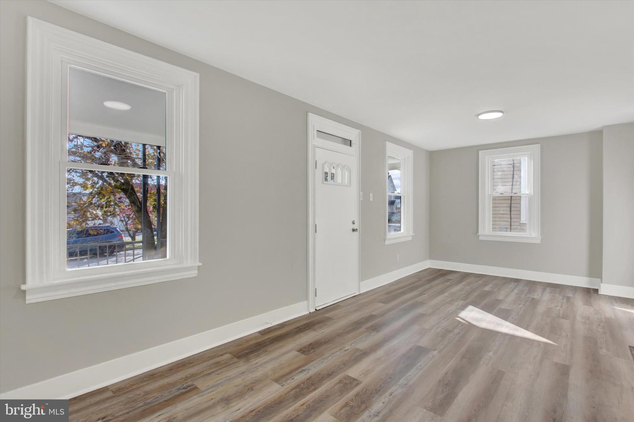 632 East Walnut Street Hanover, PA 17331 - Photo 6 of 30 a view of an empty room with window and wooden floor