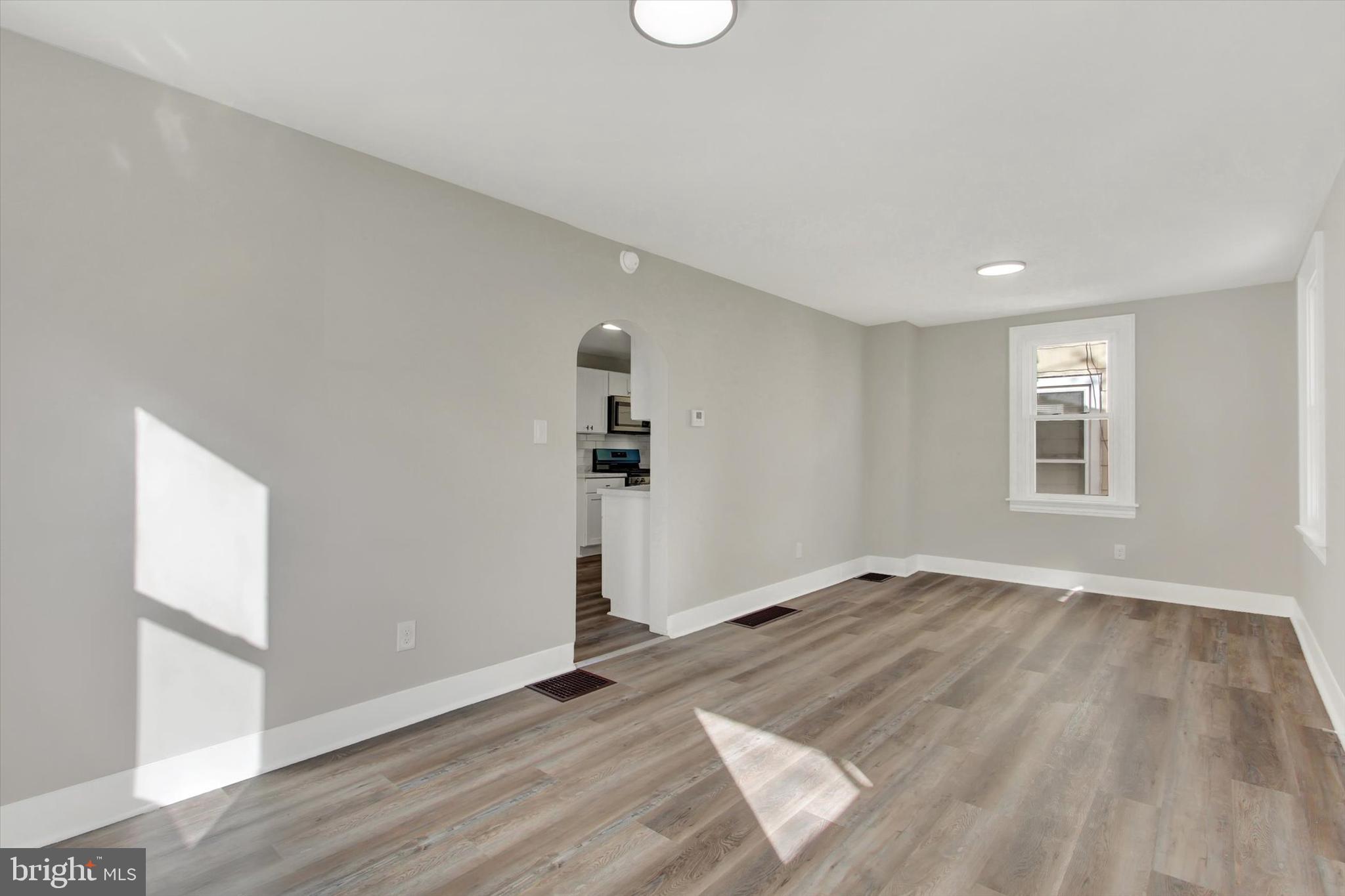 632 East Walnut Street Hanover, PA 17331 - Photo 9 of 30 an empty room with wooden floor and windows