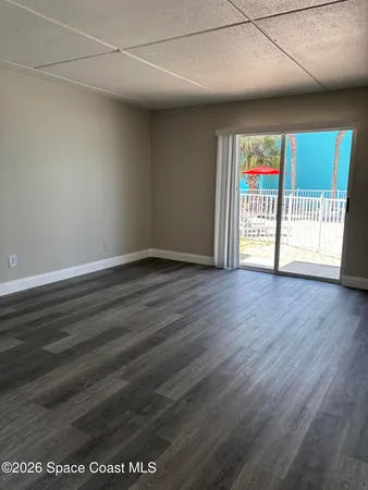 a view of a livingroom with wooden floor
