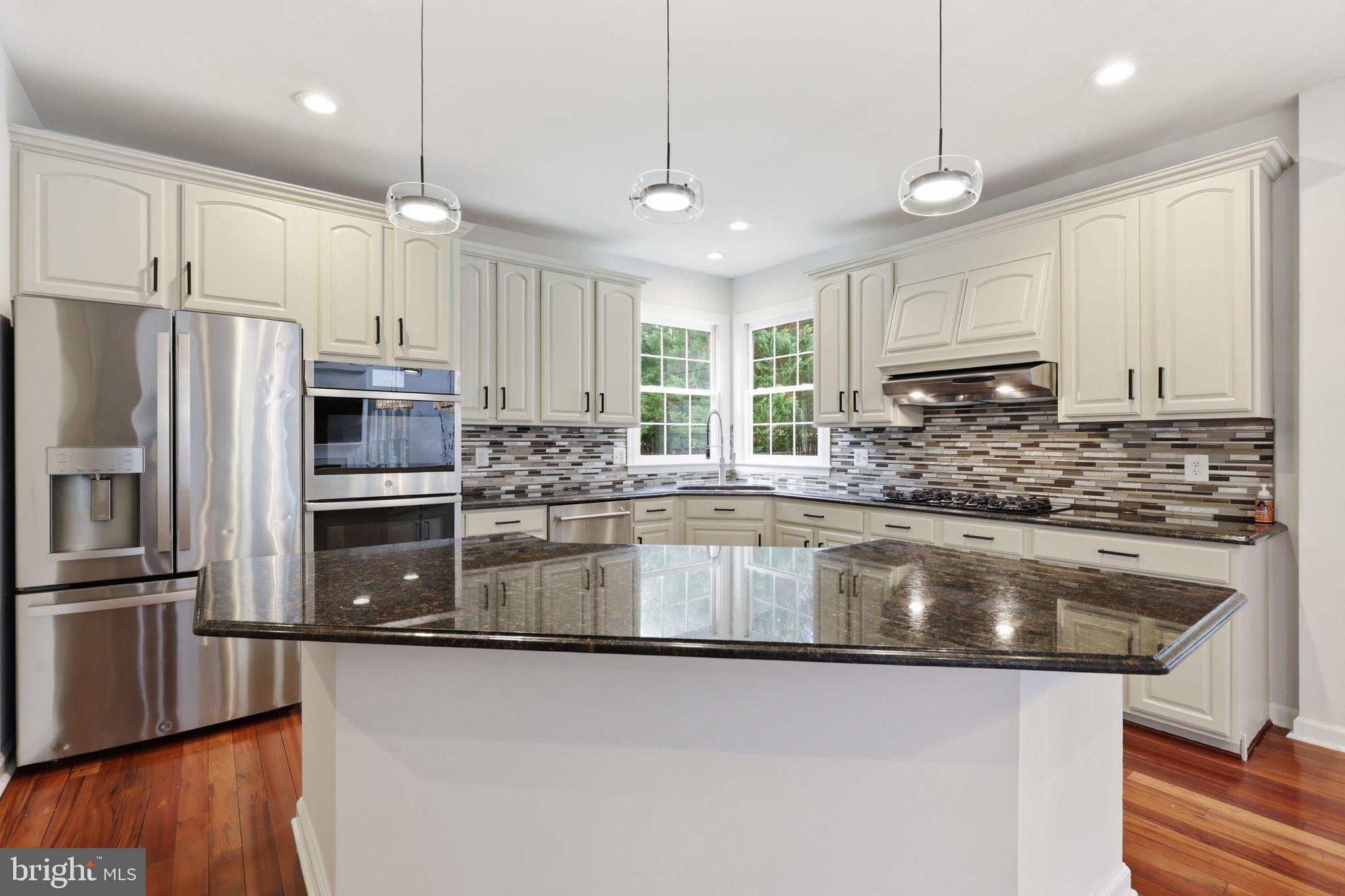 18426 Rim Rock Circle Leesburg, VA 20176 - Photo 21 of 60 Modern kitchen with sleek finishes.