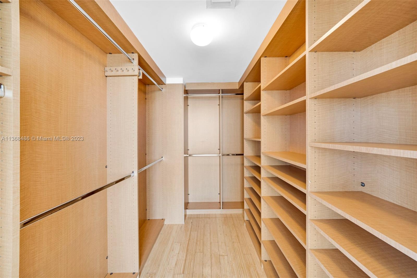 400 Alton Road, Unit 2002 Miami Beach, FL 33139 - Photo 15 of 25 a view of walk in closet with empty racks