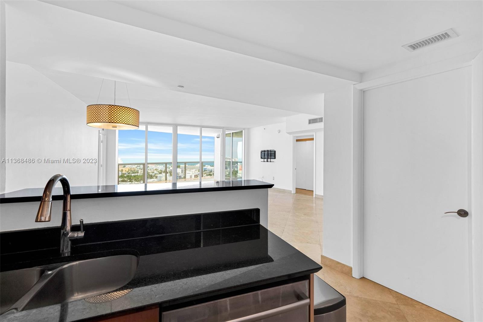 400 Alton Road, Unit 2002 Miami Beach, FL 33139 - Photo 9 of 25 a bathroom with a sink and a mirror