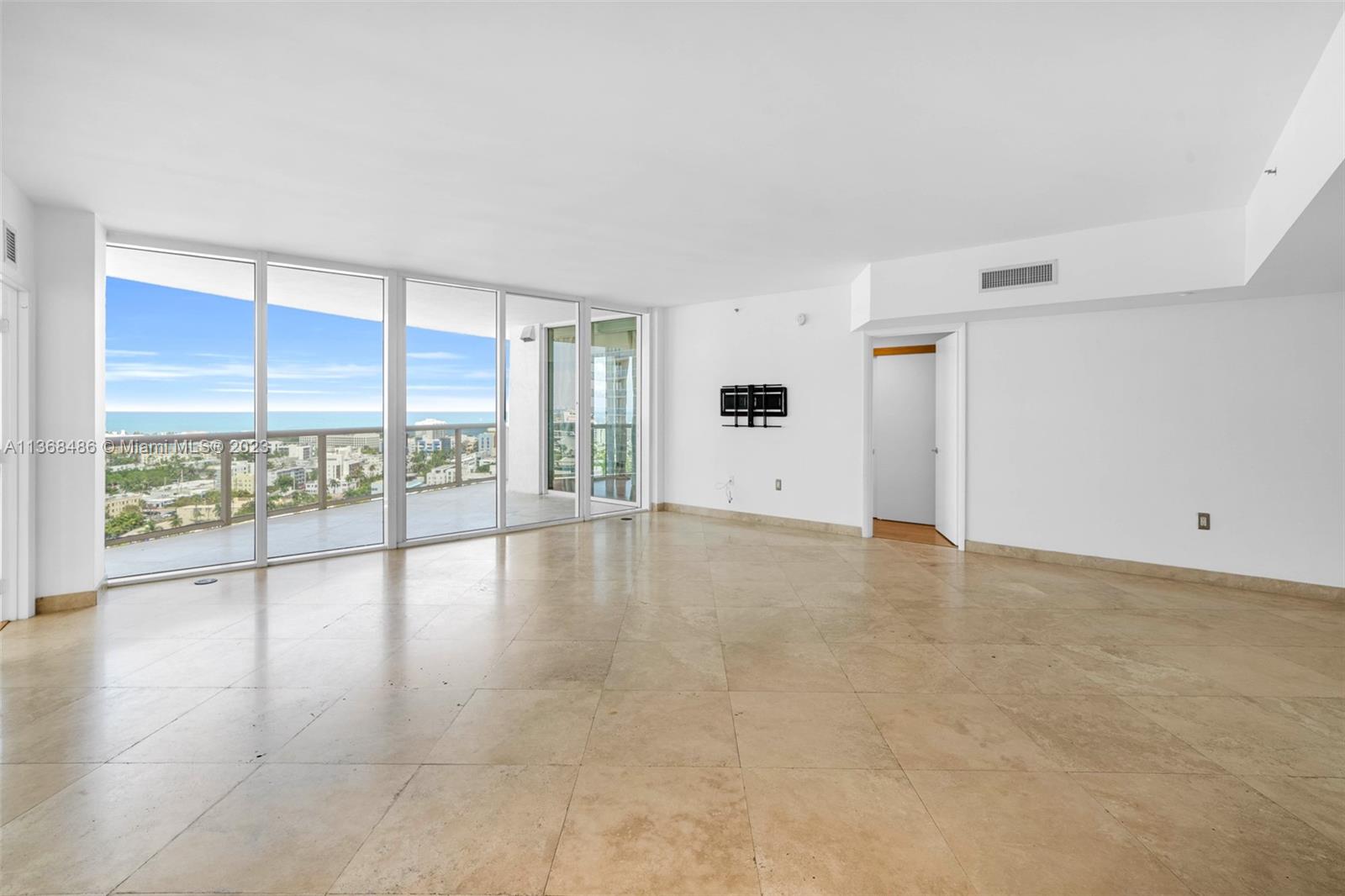 400 Alton Road, Unit 2002 Miami Beach, FL 33139 - Photo 10 of 25 a view of an empty room with a window