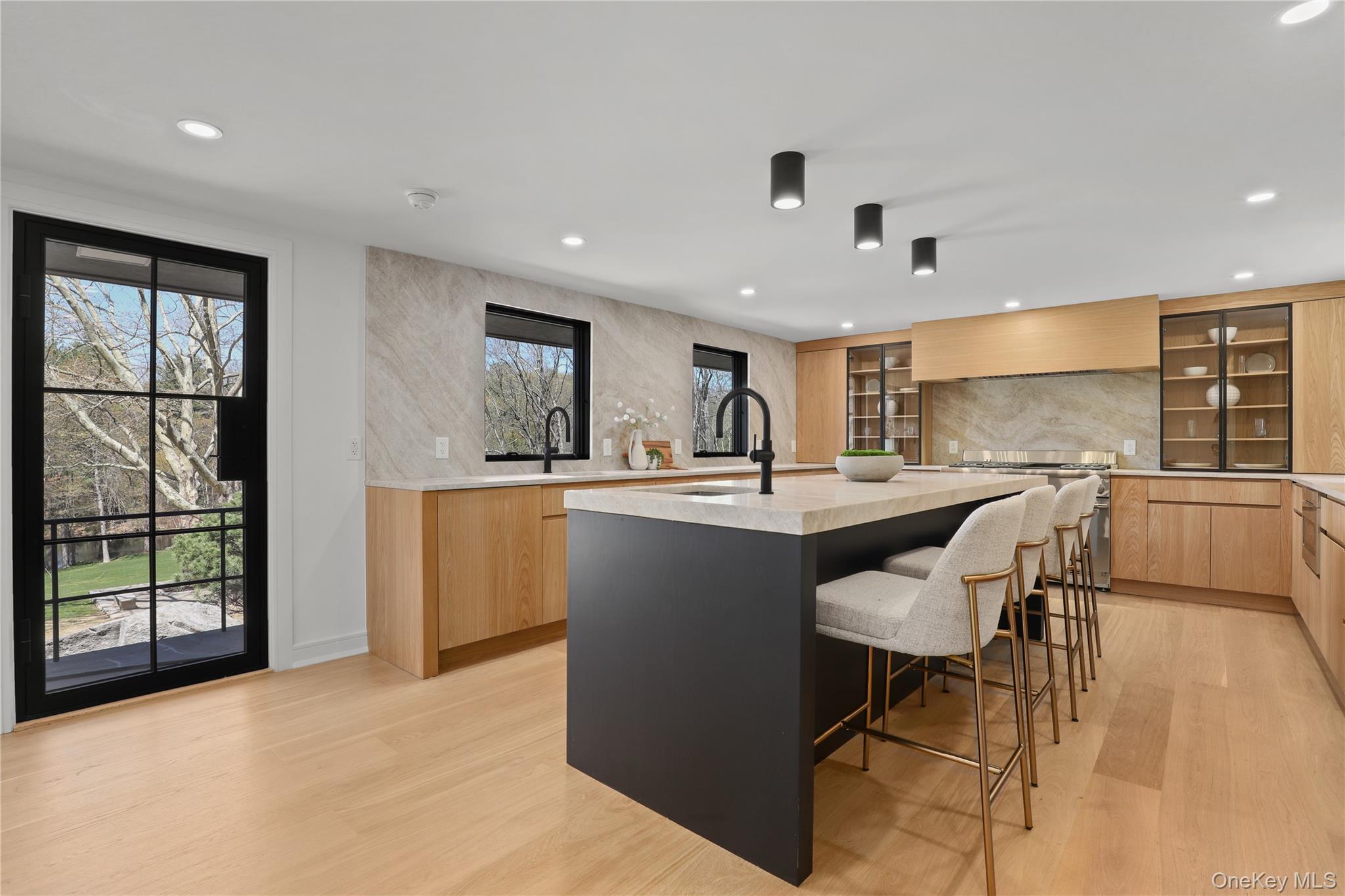 39 Old Snake Hill Road Pound Ridge, NY 10576 - Photo 12 of 37 a kitchen with a table chairs sink and cabinets