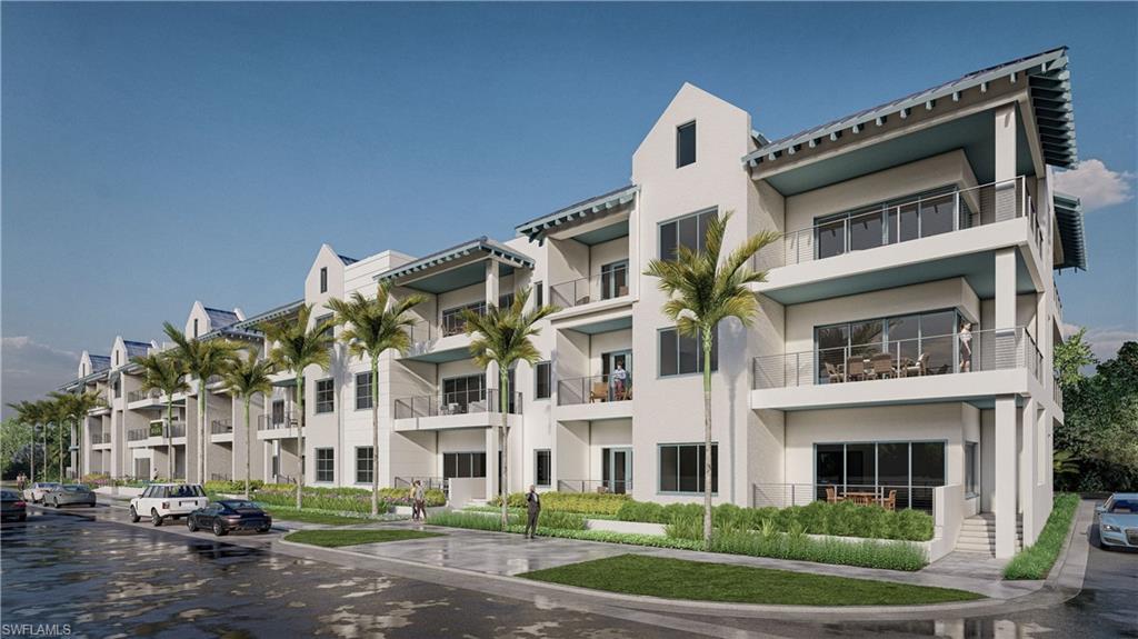 201 8th Street South, Unit 311 Naples, FL 34102 - Photo 3 of 12 a front view of building with yard