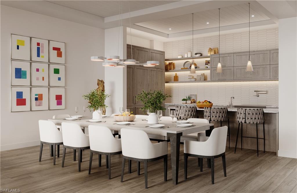 201 8th Street South, Unit 311 Naples, FL 34102 - Photo 8 of 12 a view of a dining room with furniture and wooden floor