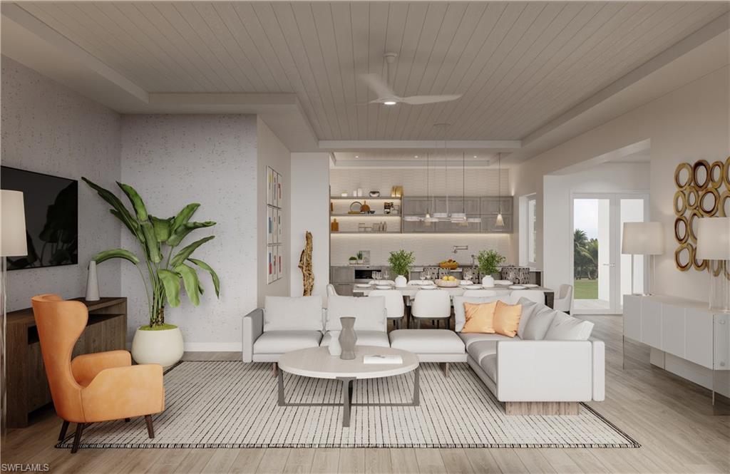 201 8th Street South, Unit 311 Naples, FL 34102 - Photo 9 of 12 a living room with furniture and a large window