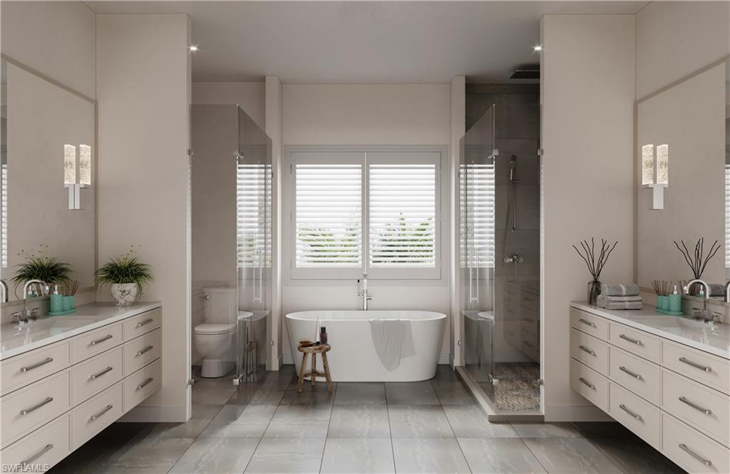 201 8th Street South, Unit 311 Naples, FL 34102 - Photo 10 of 12 a spacious bathroom with a double vanity sink a large mirror a bathtub and next to a window