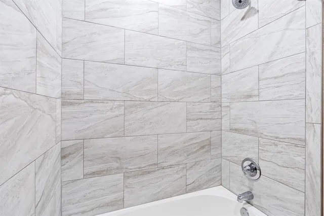 a bathroom with a white shower