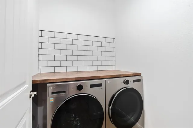 a utility room with dryer and washer