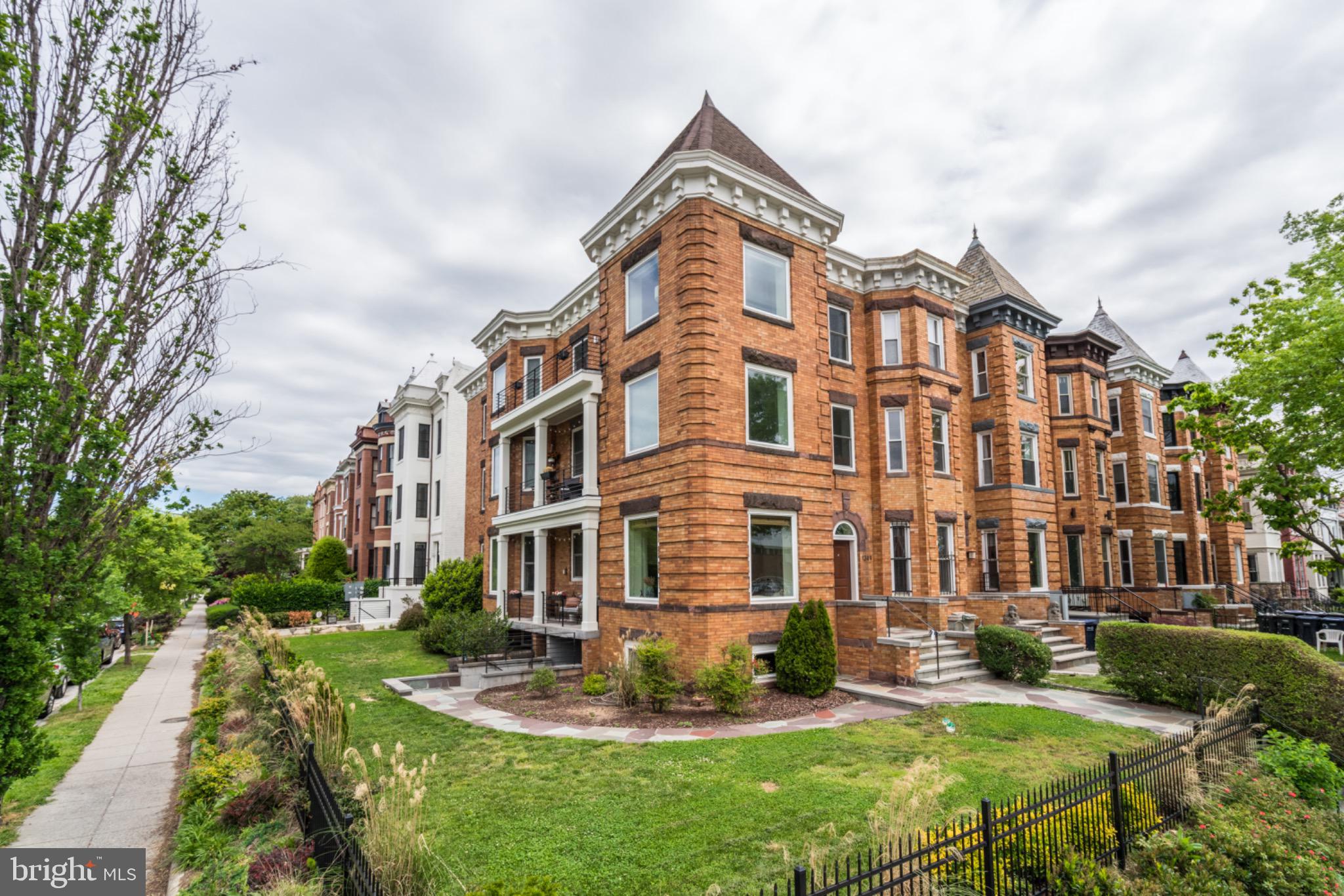 1249 Kenyon Street Northwest, Unit 2 Washington, DC 20010 - Photo 1 of 22 Charming brick residence with lush greenery.