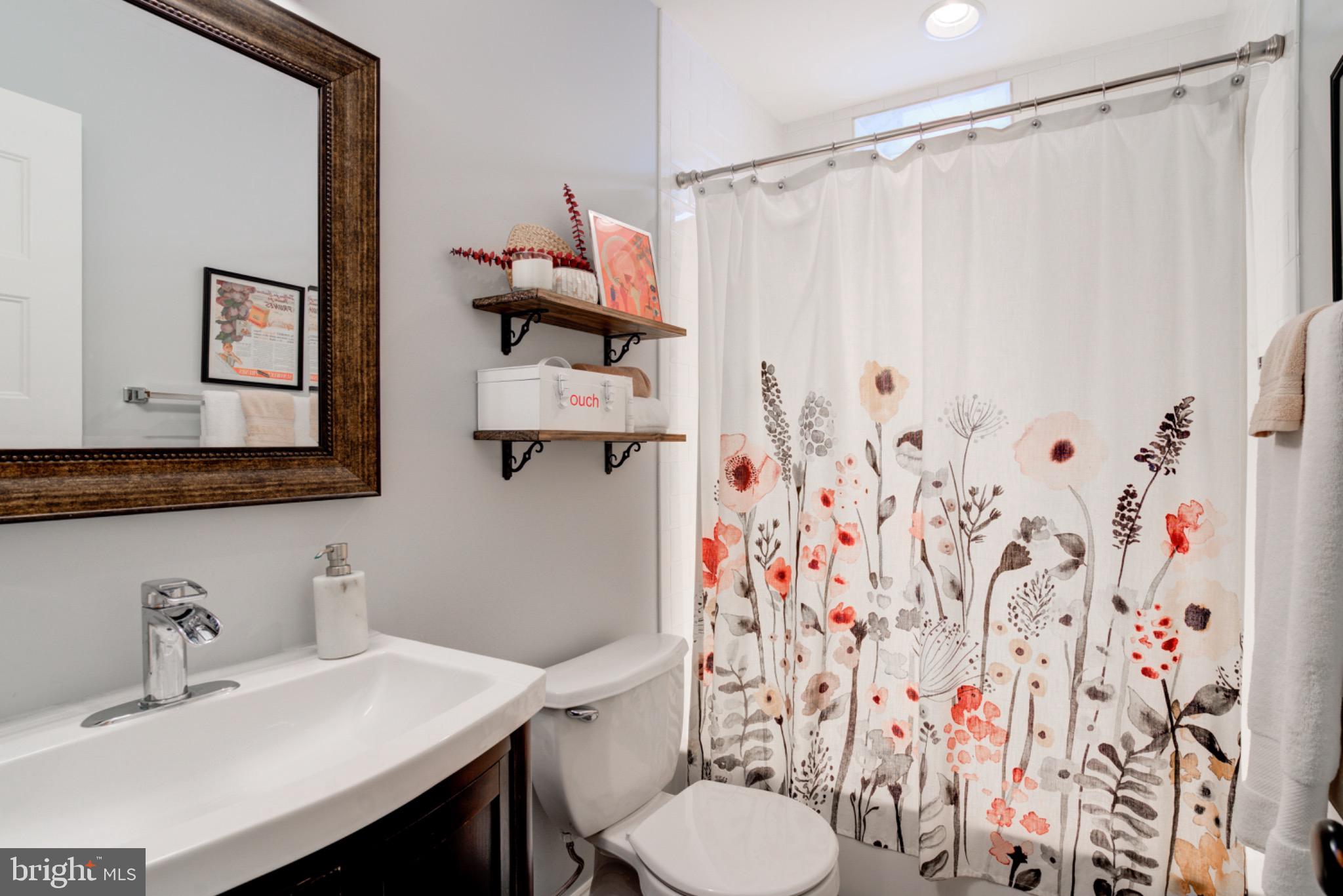 1249 Kenyon Street Northwest, Unit 2 Washington, DC 20010 - Photo 16 of 22 Charming bathroom with floral accents.
