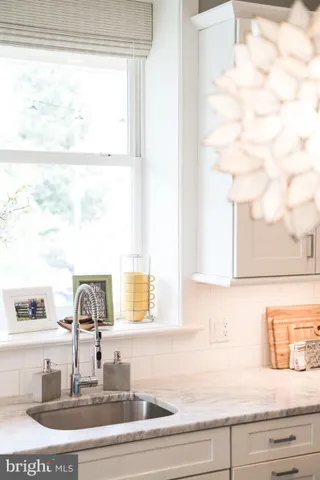 a kitchen with a sink and a window