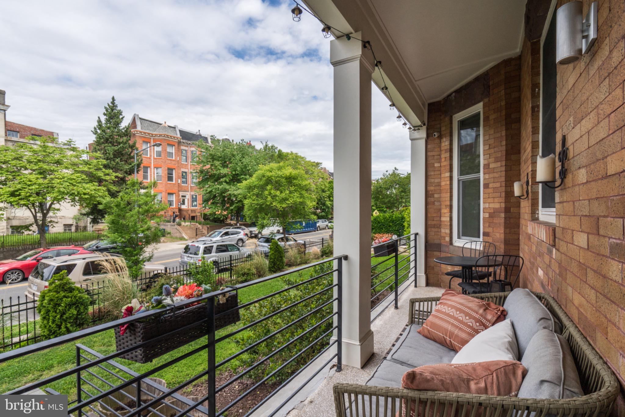 1249 Kenyon Street Northwest, Unit 2 Washington, DC 20010 - Photo 3 of 22 Charming porch with urban views and greenery.